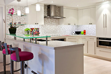 Large trendy galley light wood floor eat-in kitchen photo in Miami with a farmhouse sink, flat-panel cabinets, white cabinets, quartz countertops, gray backsplash, mosaic tile backsplash, stainless steel appliances and a peninsula
