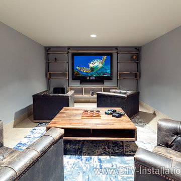 Sonos sound playbar mounted on the wall under tv in media room, Scarsdale, NY
