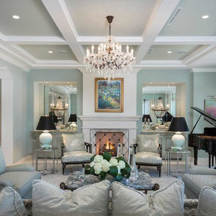 Inspiration for an expansive mediterranean formal open plan living room in Other with green walls, no tv, travertine flooring, a standard fireplace, a wooden fireplace surround and beige floors.
