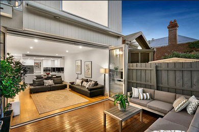 This is an example of a small traditional backyard patio in Melbourne with decking and no cover.