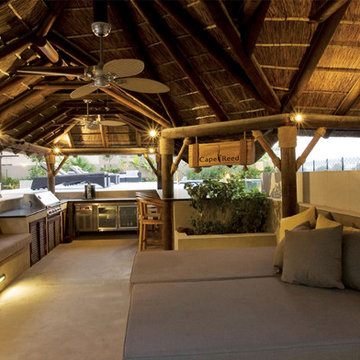 Thatch & timber is the is the focal point of this beautifully landscaped garden