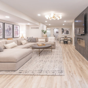 Warm & Inviting Basement Retreat with Custom Bar + Entertainment Center