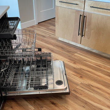 Angled Kitchen Design with Slab Style Cabinets in Pecan Stain