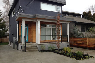 Mid-sized contemporary multicolored two-story mixed siding exterior home idea in Vancouver