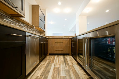 Large trendy u-shaped ceramic tile wet bar photo in Denver with an undermount sink, shaker cabinets, dark wood cabinets, quartz countertops, multicolored backsplash and glass sheet backsplash