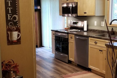 Transitional kitchen photo in Other with an undermount sink, shaker cabinets, laminate countertops and no island