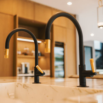 Functional Elegance: Close-Up of Double Faucet on Working Island