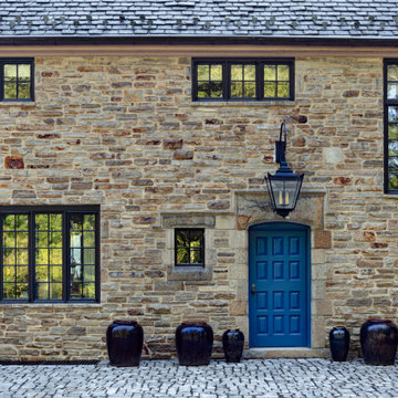 A Blue Door Complements The Stone Facade