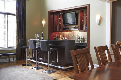 This is an example of a contemporary home bar in New York.