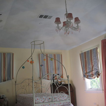 Clouds painted on ceiling in kids rooms