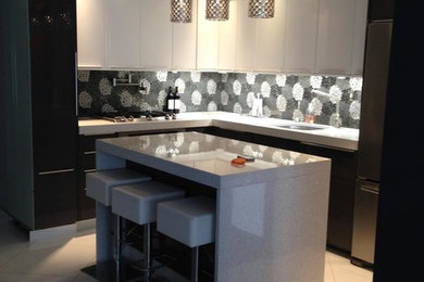 Mid-sized minimalist eat-in kitchen photo in New York with a single-bowl sink, black cabinets and an island