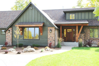 Green two-story wood gable roof idea in Other
