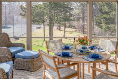 Inspiration for a nautical screened veranda in Boston with a roof extension.