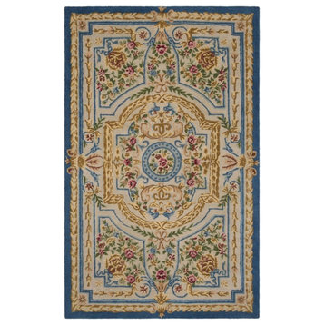 Safavieh Savonnerie 9' x 12' Hand Tufted Wool Rug in Blue and Ivory