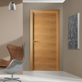 Photo of a small modern home studio in New York with beige walls, lino flooring and a freestanding desk.