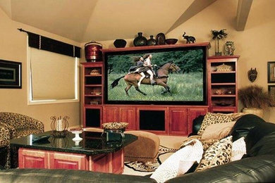 Inspiration for a mid-sized traditional home theatre in Seattle with beige walls, a built-in media wall and beige floor.