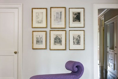 Example of a mid-sized transitional medium tone wood floor and brown floor hallway design in DC Metro with gray walls