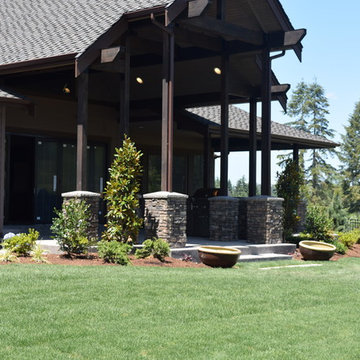 Stone outdoor kitchen and matching fire table