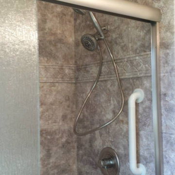 River Rock slate embossed shower wall with Listello trim