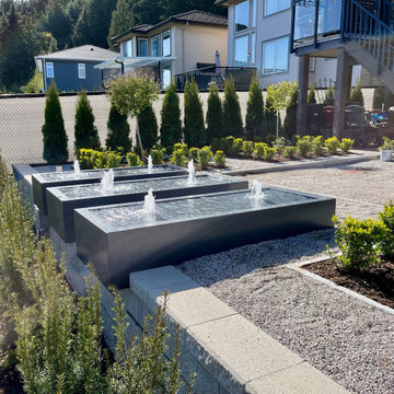 Water tables overhanging and embedded in the retaining wall