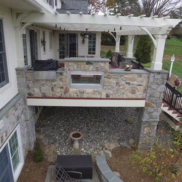 Zuri Deck with Cedar Pergola and Stone Fireplace with Grill