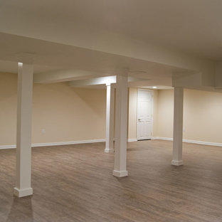 Design ideas for a medium sized classic fully buried basement in New York with beige walls, no fireplace and dark hardwood flooring.