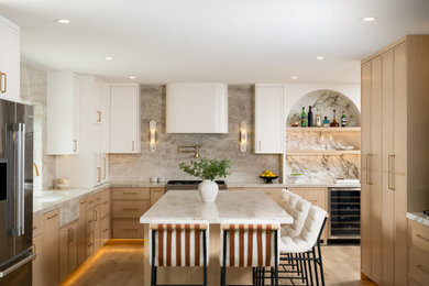 Mid-sized transitional l-shaped light wood floor eat-in kitchen photo in Orange County with an integrated sink, shaker cabinets, light wood cabinets, quartzite countertops, multicolored backsplash, stone slab backsplash, paneled appliances, an island and multicolored countertops