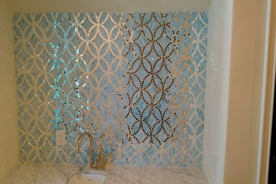 Example of a home bar design in Miami with glass tile backsplash
