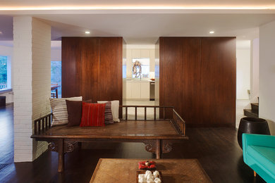 Minimalist dark wood floor living room photo in DC Metro with white walls