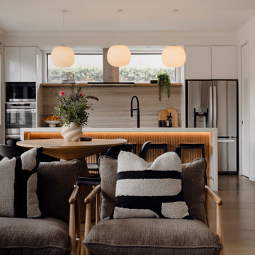 Warm Neutral Kitchen and Dining with Textured Island Detail | Modern Coastal Int