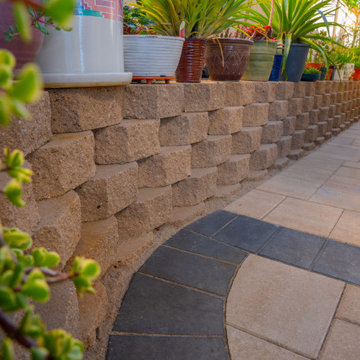 Elegant Outdoor Transformation with Retaining Wall & Paver Design