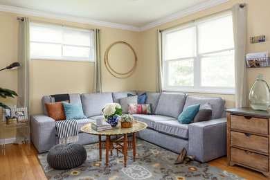Living room - small transitional open concept light wood floor living room idea in DC Metro with beige walls, no fireplace and a tv stand