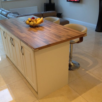 Ivory Vinyl, hammered pewter handle, walnut butcher block work top.