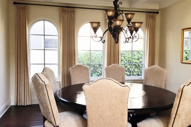 Enclosed dining room - large mediterranean dark wood floor and brown floor enclosed dining room idea in Los Angeles with beige walls and no fireplace