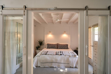 Bedroom - mid-sized modern master concrete floor and gray floor bedroom idea in Santa Barbara with white walls