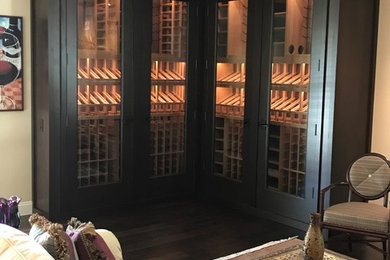 Example of a mid-sized trendy dark wood floor wine cellar design in Sacramento