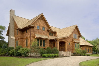 Large traditional beige two-story wood exterior home idea in New York with a shingle roof