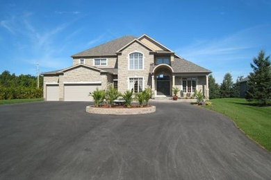 Tuscan home design photo in Ottawa