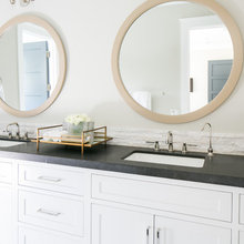 honed black granite counters in bath