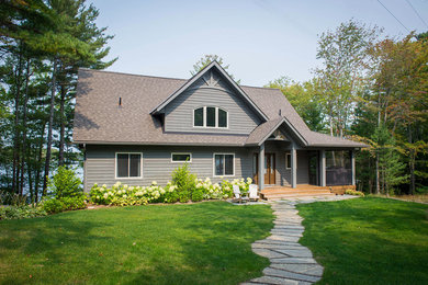 Large traditional gray split-level wood house exterior idea in Toronto with a shingle roof