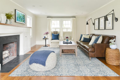 Living room - mid-sized transitional open concept medium tone wood floor and brown floor living room idea in Boston with a standard fireplace, a stone fireplace and a wall-mounted tv