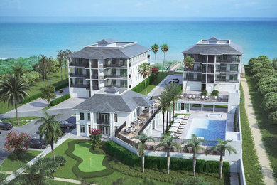 Design ideas for a huge traditional full sun front yard concrete paver formal garden in Miami.