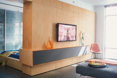 Small minimalist open concept ceramic tile living room photo in Los Angeles with white walls and a media wall