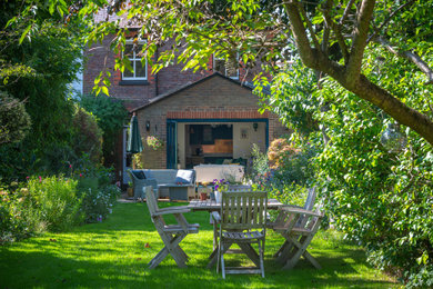 This is an example of a contemporary garden in Surrey.