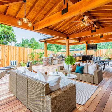 Redwood decking and redwood patio cover area with lighting and fans