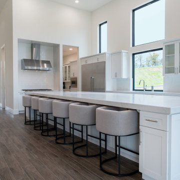 Modern White Shaker Kitchen with Oversized Island & Custom Storage Solutions