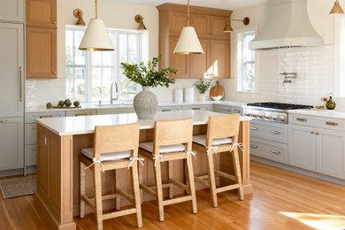 Inspiration for a transitional kitchen remodel in Boston with shaker cabinets, gray cabinets, quartzite countertops and an island
