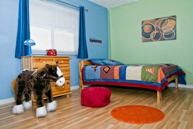 Mid-sized elegant boy light wood floor and brown floor kids' room photo in Toronto with multicolored walls