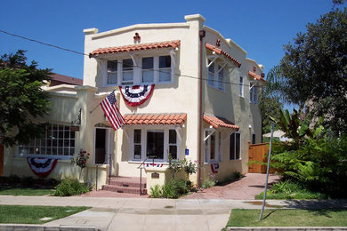 Traditional two-story stucco exterior home idea in San Diego