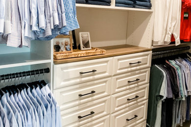Custom primary closet with drawers and vanity top